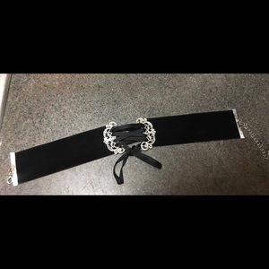 Velvet choker with criss-cross tie detail.
